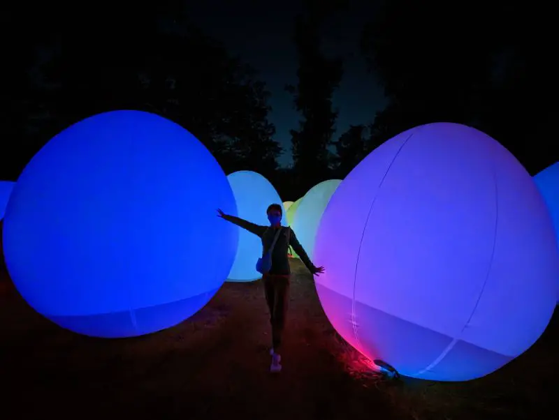 Jackie Szeto, Life Of Doing, touch the inflatable purple colored eggs at TeamLab Botanical Garden Osaka