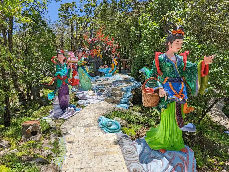 Five colorful statues of female dieties holding peaches, located at Sapa Heaven Gate