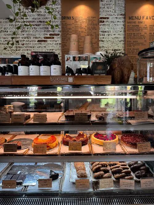 Three rows of desserts and sweets such as cakes, brownies, and cookies at Shady Shack in Canggu, Bali