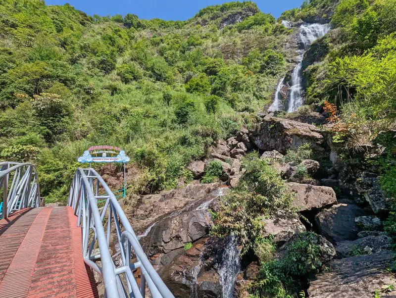 A bridge next to the water cascades of Silver Waterfall, Sapa, Vietnam