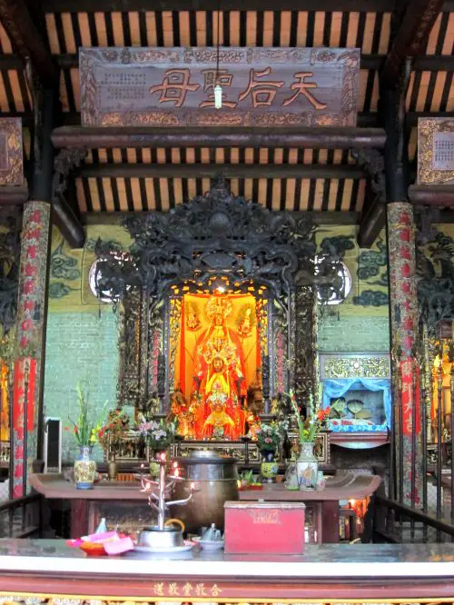 A praying area with golden Goddess at the Thien Hau Temple in Ho Chi Minh City, Vietnam