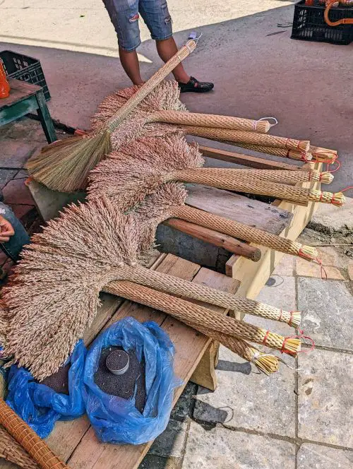 Ten brooms for sale at Bac Ha Market