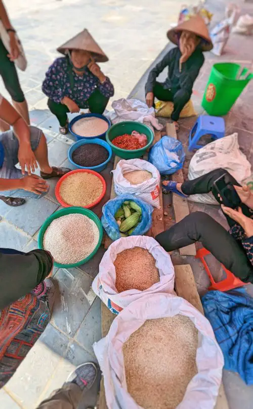 A few sellers trying to sell five kinds of rice and spices at Bac Ha Market