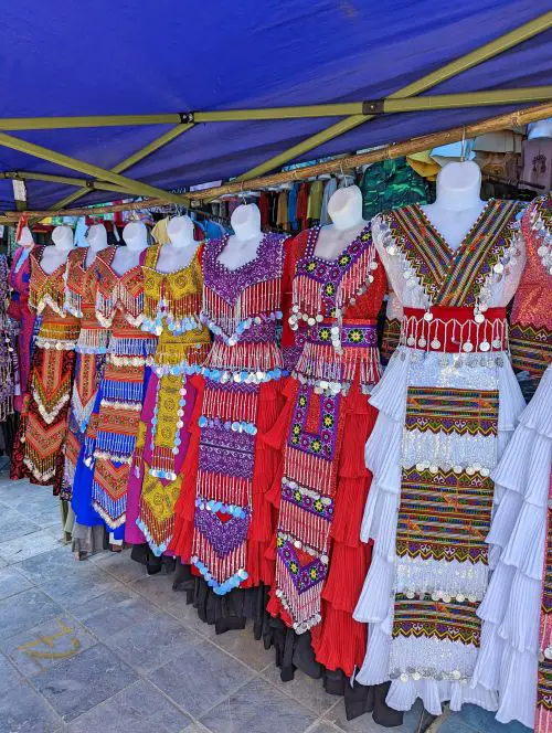 Colorful dresses for formal events and festivals for sale at Bac Ha Market