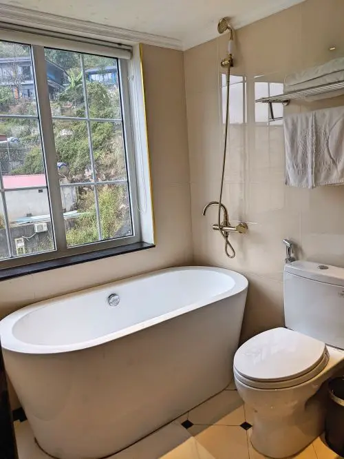 A tub and toilet at My Boutique Hotel in Sapa, Vietnam