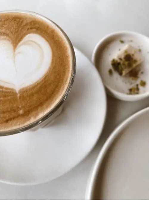 A cup of coffee with heart shaped latte art
