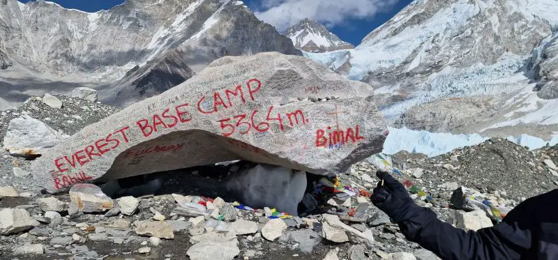 Everest Base Camp 5364 m is spray painted red on a rock