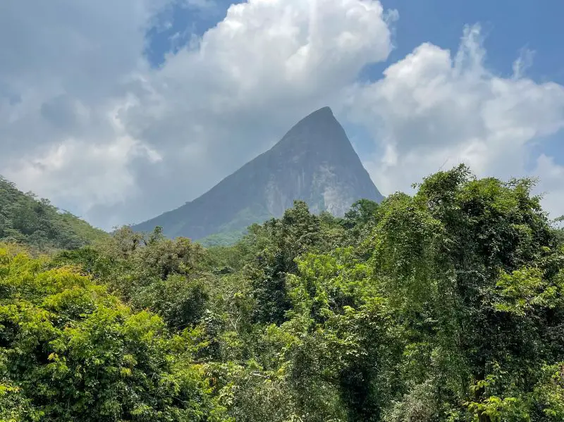 Luscious forest areas surround a pointy mountain in the Meemure area of Sri Lanka
