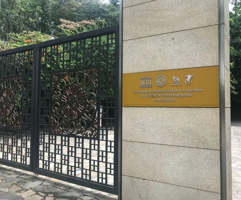 The gates of Singapore Botanic Gardens with a sign of UNESCO World Heritage Site recognition on July 4, 2015