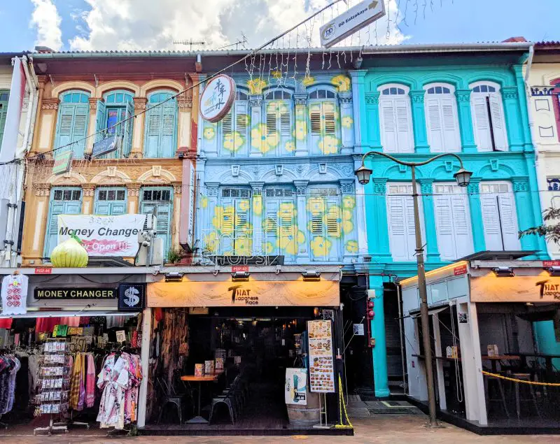 Colorful houses with first level store fronts on the main street of Singapore's Chinatown area