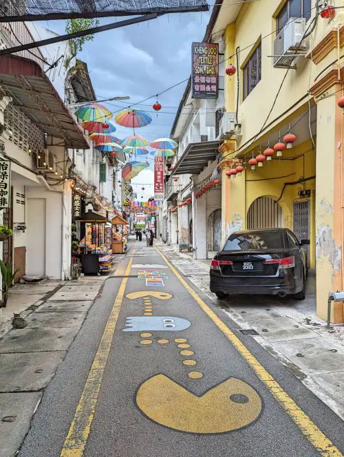 Market Street in Ipoh has fun street art such as Pac Man and colorful overhead umbrellas