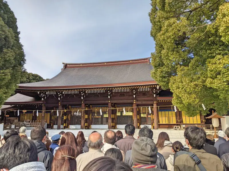 Crowds of people waiting in front of Meiji Shrine to make prayers at New Year time
