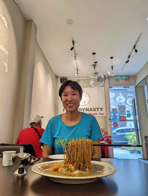 Jackie Szeto, Life Of Doing, sits behind the floating sang mee noodles at Food Dynasty in Penang