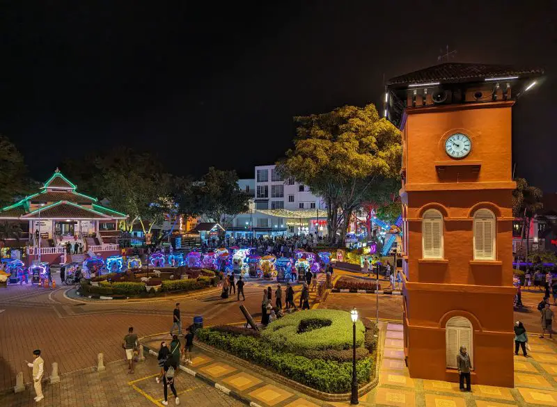 At night, Melaka's Dutch Square has lit trishaws waiting for customers