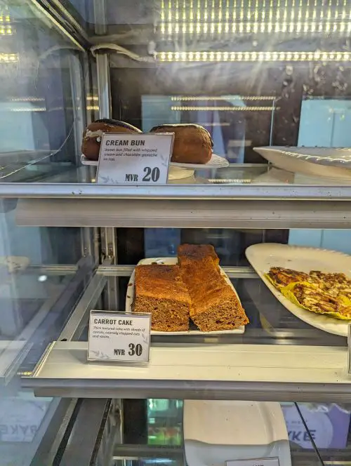 A display of cream beans and carrot cake at Fine Bake by Suzy, Maafushi, Maldives