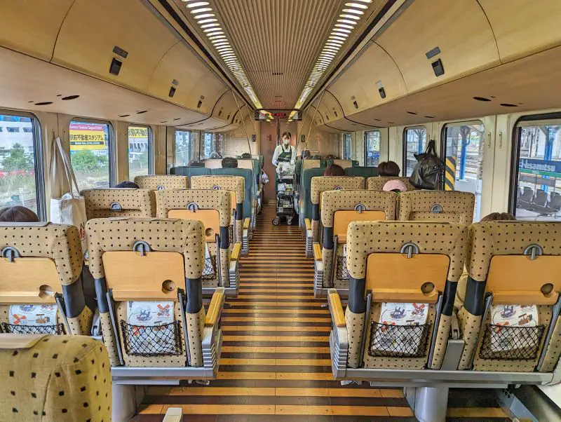 Inside Car 3 of Yufuin no Mori train and has the beige seats with black dots