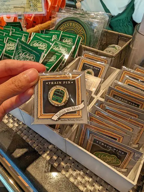 A train pin for sale on the Yufuin no Mori train