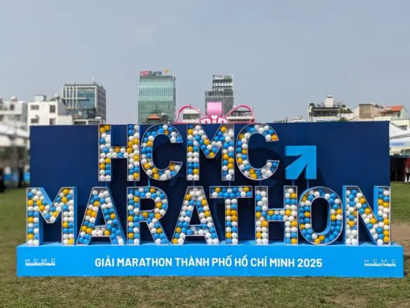 Large Hollywood letters that says HCMC Marathon on display at the Expo