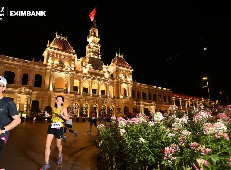 Jackie Szeto, Life Of Doing, runs along Nguyen Hue Walking Street at the HCMC Night Run