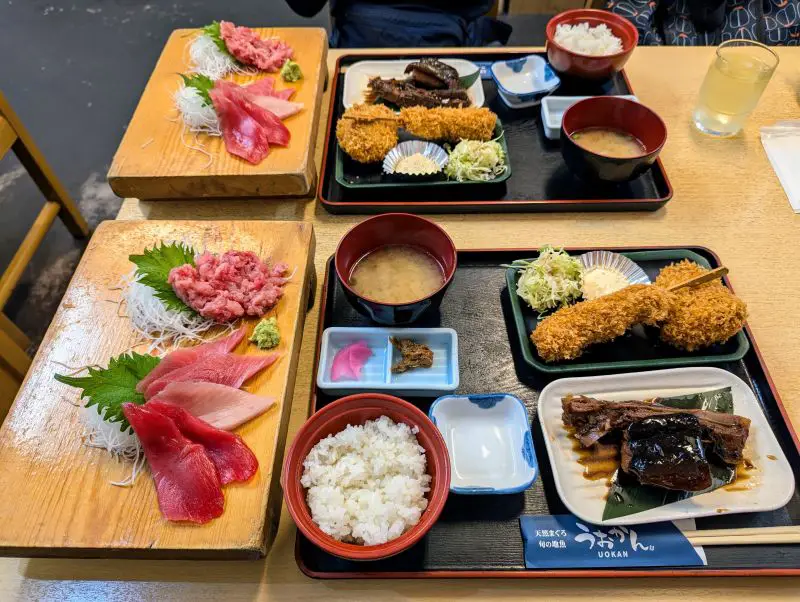 A close up of the tuna meal including braised tuna jaw, tuna croquette, tuna sashimi, and miso soup at Shimizu Fish Market's Uozan restaurant