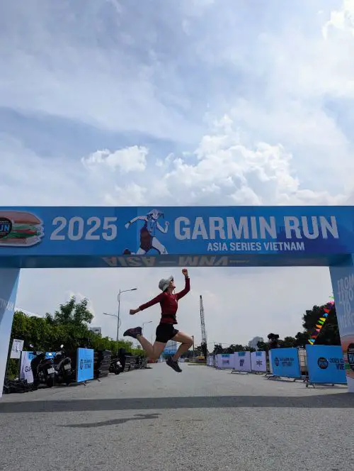 Jackie Szeto, Life Of Doing, jumps in front of the Garmin Run Vietnam Start Line after bib pick up