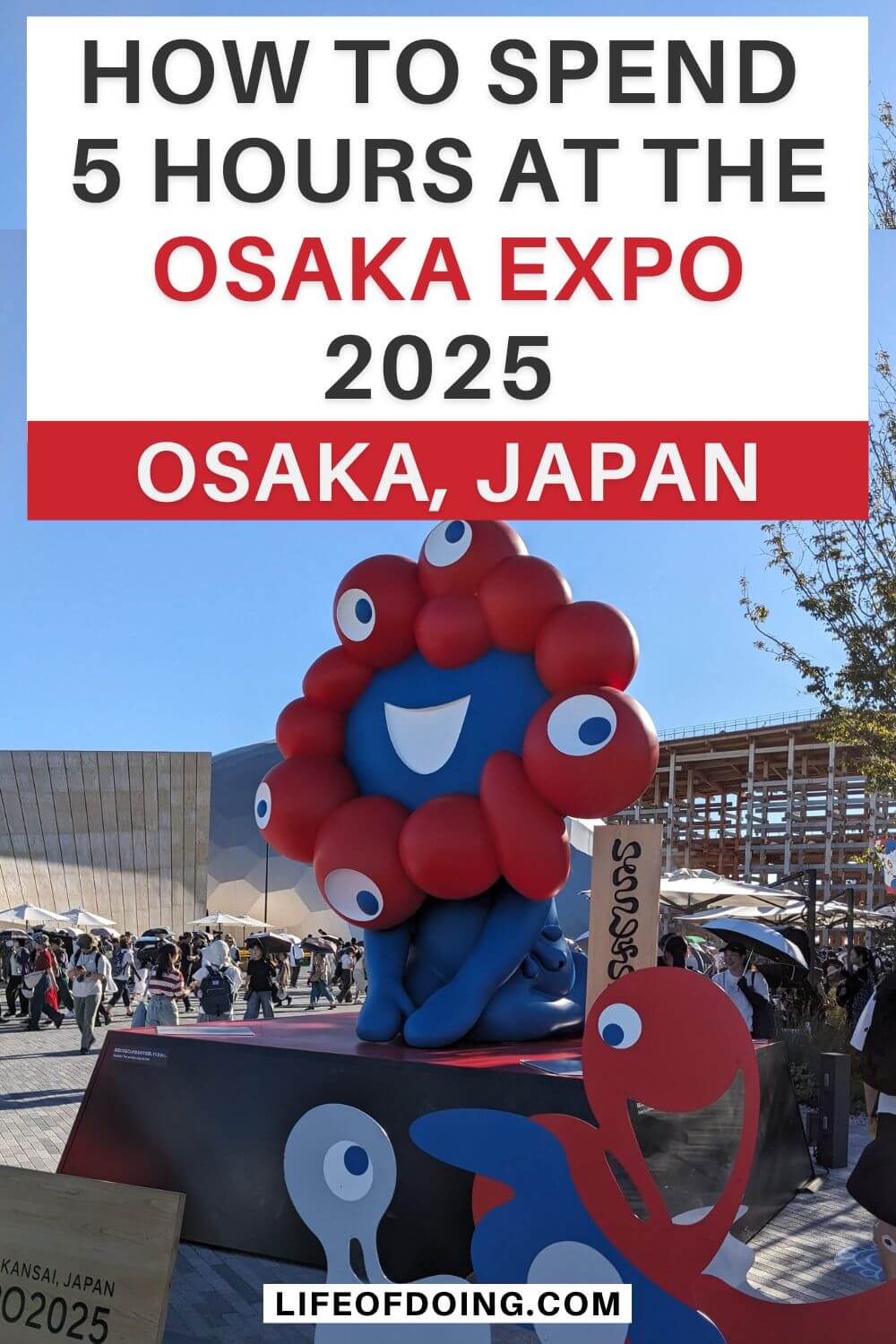 A statue of Myaku Myaku, the red cell and water mascot of the Osaka Expo