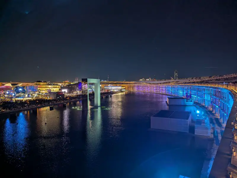 Blue and purple lights lit the edge of the water around the Grand Ring
