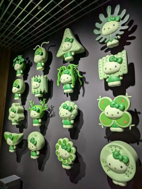 Sixteen different types of Hello Kitty shaped as algae on a wall at the Osaka Expo Japan Pavilion