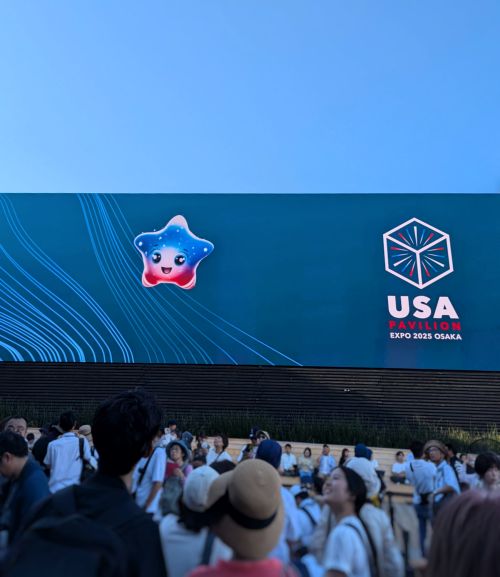 Spark is the mascot for the USA Pavilion and she is on the outside TV displays