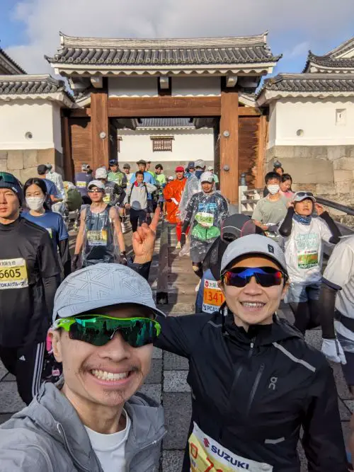 Justin Huynh, Life Of Doing, and a friend head towards the Shizuoka Marathon start line