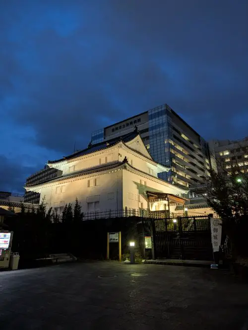 One of the Sumpu Castle Park area buildings lit up at night in Shizuoka City, Japan