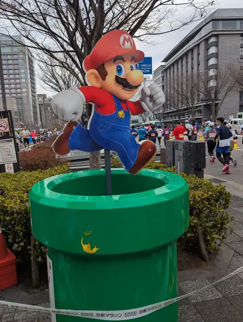 A U-turn sign of Mario from Super Mario Bros. along the Kyoto Marathon course
